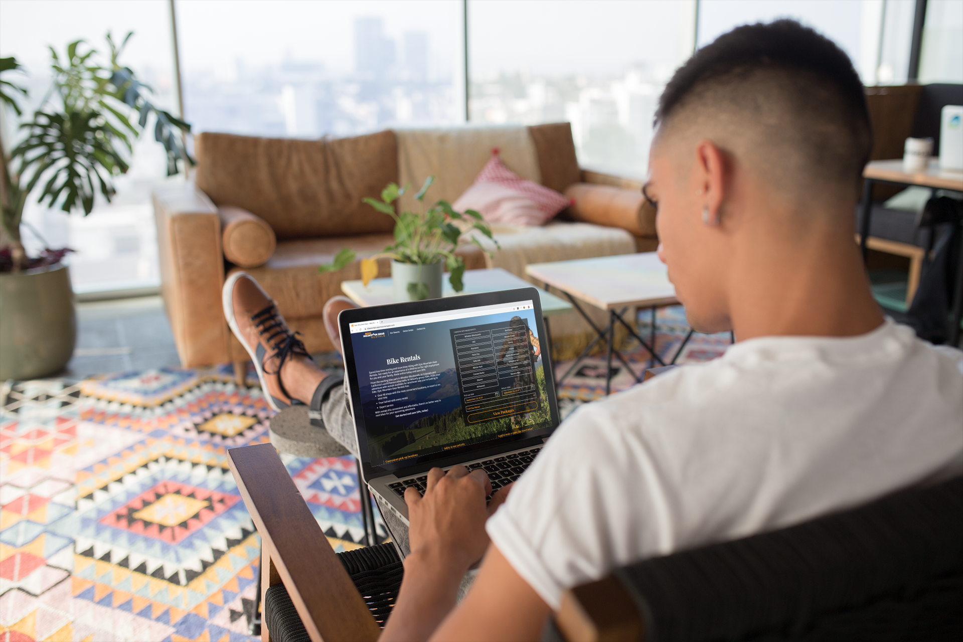 man working on laptop in home office